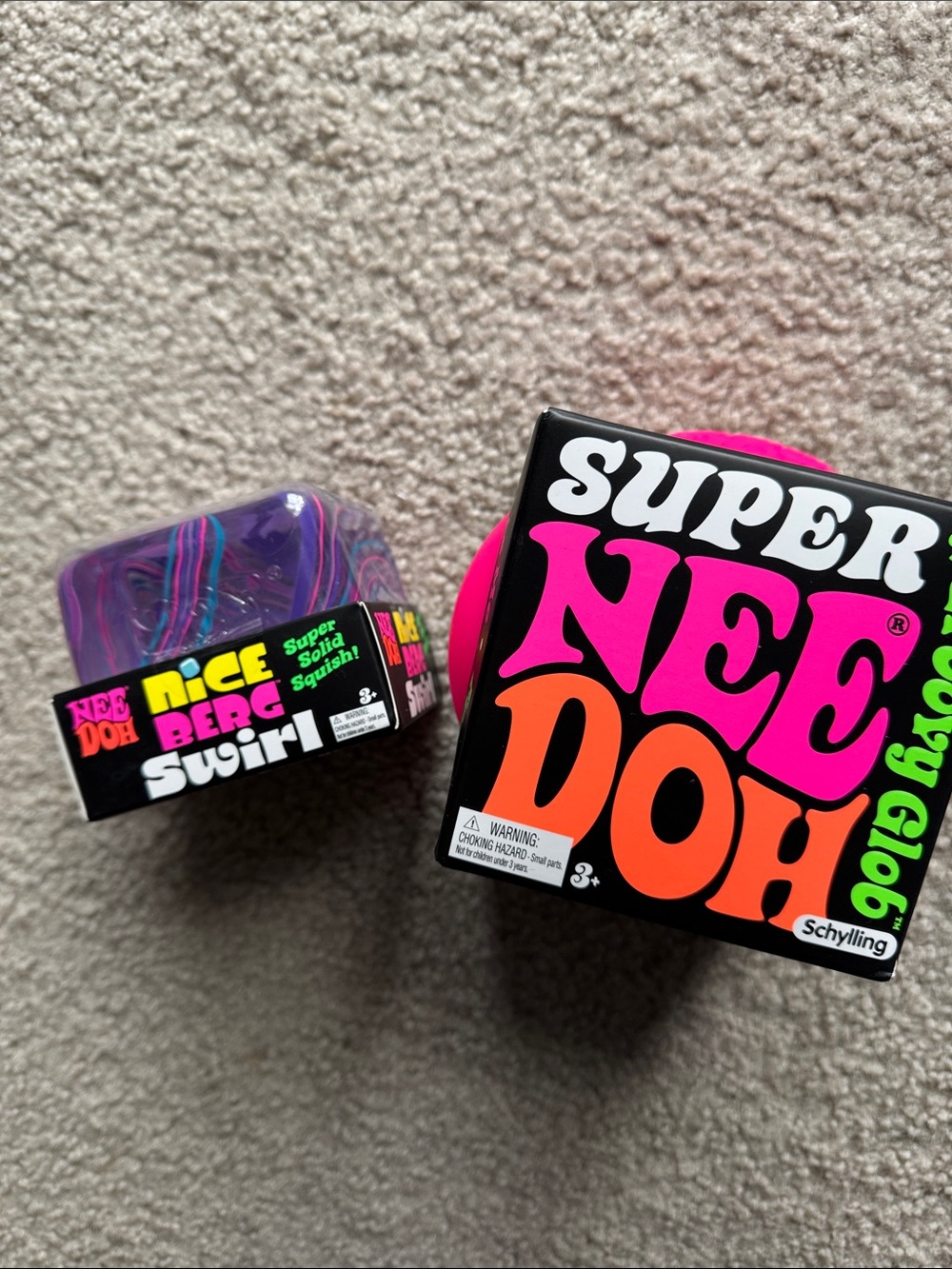Super NeeDoh Groovy Glob and Nice Berg Swirl— both in pink!